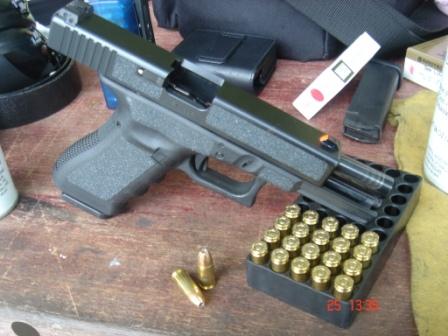 Glock handgun and live ammunition prepared for target shooting session