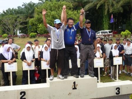 Singapore Rifle Association tournament champions receiving podium awards